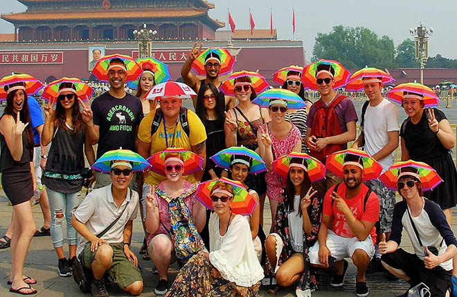 A Canadian stranger, who remembered to bring his ‘Canada umbrella’ hat, joins the China Study Tour for a photo op at Tiananmen Square in Beijing