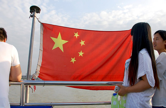 China’s national flag captures the attention of passengers on the Yangtze River ferry that travels between Hankou and Wuchang in Wuhan
