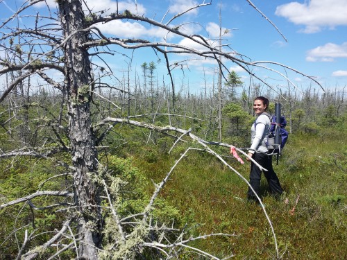 Fernanda Moreira Amaral standing in the woods as an intern with Geomatics