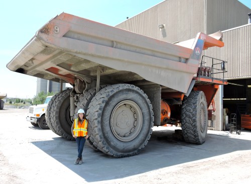 Natalia Da Silva Fontoura poses with a large cement truck at St. Mary's Cement